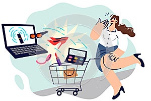 Shopaholic woman is doing online shopping on laptop, standing near supermarket cart