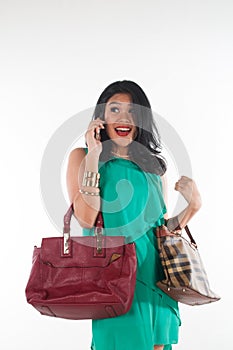 Shopaholic woman spending money and credit card for branded item
