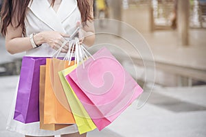 Shopaholic Women holding shopping bags ,money ,credit card person at shopping malls.Fashionable Woman love online website with