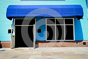 Shopfront vintage store front with canvas awnings photo