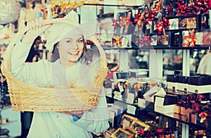 Shopgirl posing with delicious ganaches, praline and chocolates