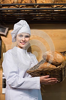 Shopgirl working in bakery with different pastry