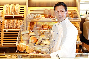 Shopkeeper with basket of bread