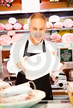 Shopkeeper serving a customer