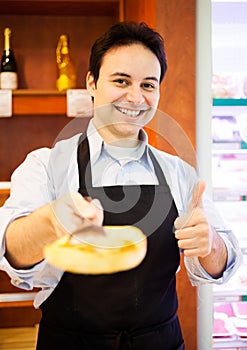 Shopkeeper serving a customer