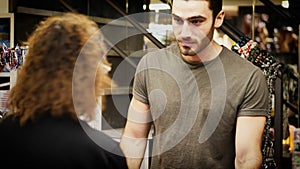 Shopkeeper serving customer