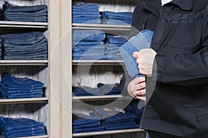 Shoplifter stealing denim