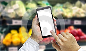 Shopper Mobile smart phone in hand, and see more detail and compare the prices in supermarkets