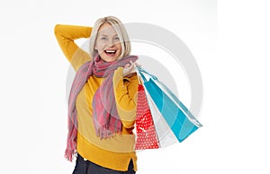 Shopper. Shopaholic shopping woman holding many shopping bags excited isolated on white. photo