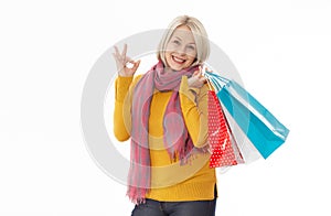 Shopper. Shopaholic shopping woman holding many shopping bags excited isolated on white. photo