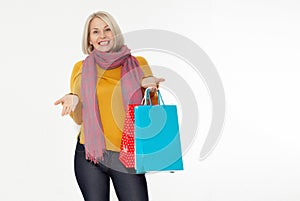 Shopper. Shopaholic shopping woman holding many shopping bags excited isolated on white. photo