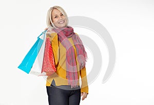 Shopper. Shopaholic shopping woman holding many shopping bags excited isolated on white. photo