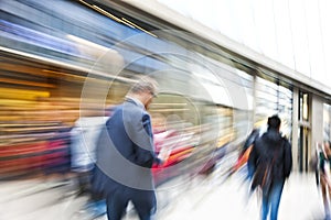 Shopper walking past a store window