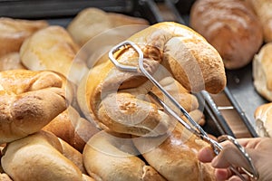 Shoppers hand holding mexican pan dulce