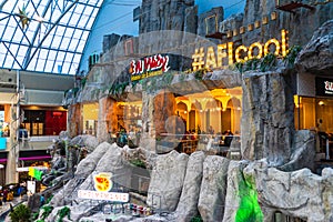 Shoppers visit the mall during winter at discount and sale season. Food court in AFI Cotroceni Shopping Mall in Bucharest, Romania