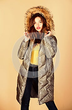 Shopping in any weather. flu and cold. seasonal fashion. woman in padded warm coat. beauty in winter clothing. cold