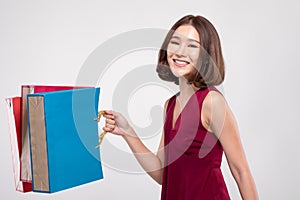 Shopping Asian woman with short hairs smile and Holding Shopping bags