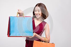 Shopping Asian woman with short hairs smile and Holding Shopping bags