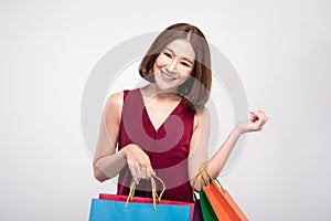 Shopping Asian woman with short hairs smile and Holding Shopping bags