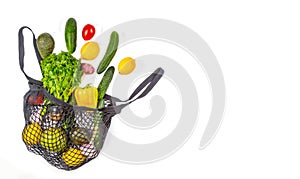 .Shopping bag with assortment of fresh vegetables on white background