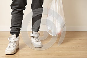 shopping bag carried by a person with a tracksuit