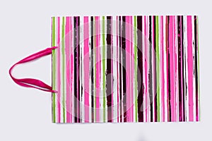 Shopping bag with pink stripes.
