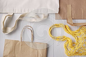 Shopping bag, yellow mesh bag and paper bags for products on a white background, Zero waste concept