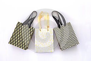 Shopping bags, gift boxes in modern style on white background. Golden stars, black geometric lines- fashion modern design. Minimal