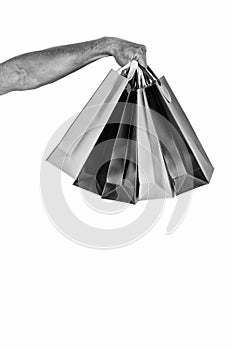 Shopping bags in hand isolated white background. Paper bags packages. Shopping and package concept. Holidays preparation