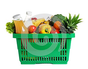 Shopping basket with grocery products on background