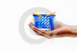 Shopping basket on a hand, white background