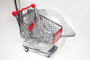 Shopping basket and laptop