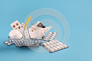 Shopping basket with medicinal pills and tablets