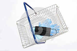 Shopping basket with mouth protection and hand gloves, isolated on white background