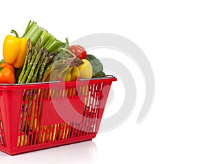 Shopping Basket oveflowing with fresh Vegetables