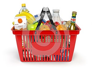 Shopping basket with variety of grocery products isolated on white background. photo