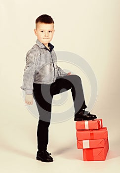 Shopping. Boxing day. New year. little boy with valentines gift. happy child with present box. Christmas. shop assistant