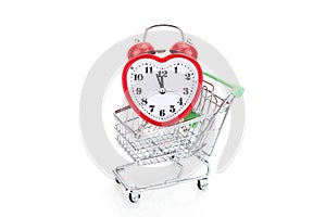 Shopping cart with alarm clock in shape of a heart