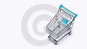 Shopping cart with blue handles for transporting goods.