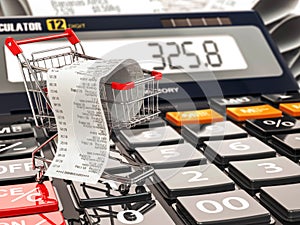 Shopping cart on calculator and receipt. Home budget or consumer