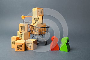 Shopping cart with cardboard boxes with a pattern of trading carts a buyer and seller, manufacturer and retailer. Business