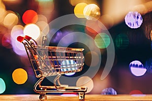 Shopping cart with colourful circular bokeh and reflections background