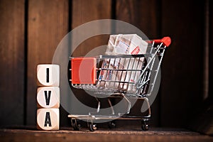 Shopping cart and cubes with the word TAX