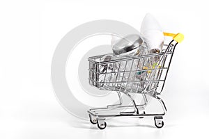 A shopping cart with energy saving light bulbs. A notion of buying electric appliances
