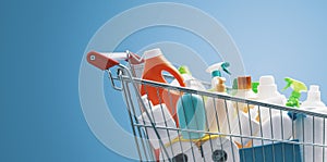 Shopping cart filled with detergents photo