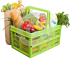 Shopping cart filled with various groceries on