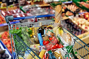 Shopping cart with foods photo