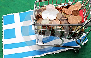 Shopping cart full of euro over Flag of Greece