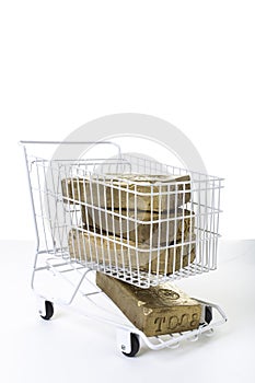 Shopping cart full of gold concept