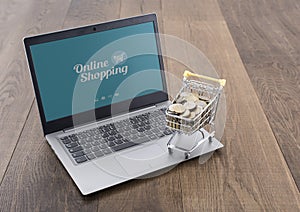 Shopping cart full of money and laptop